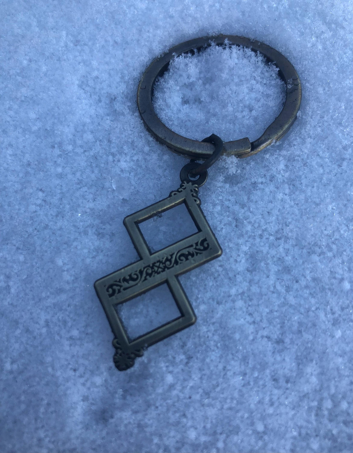 Twisted One Symbol - Blasphemous Inspired Double-sided Keychain