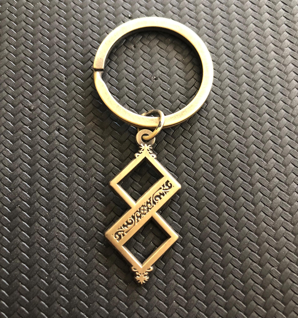 Twisted One Symbol - Blasphemous Inspired Double-sided Keychain