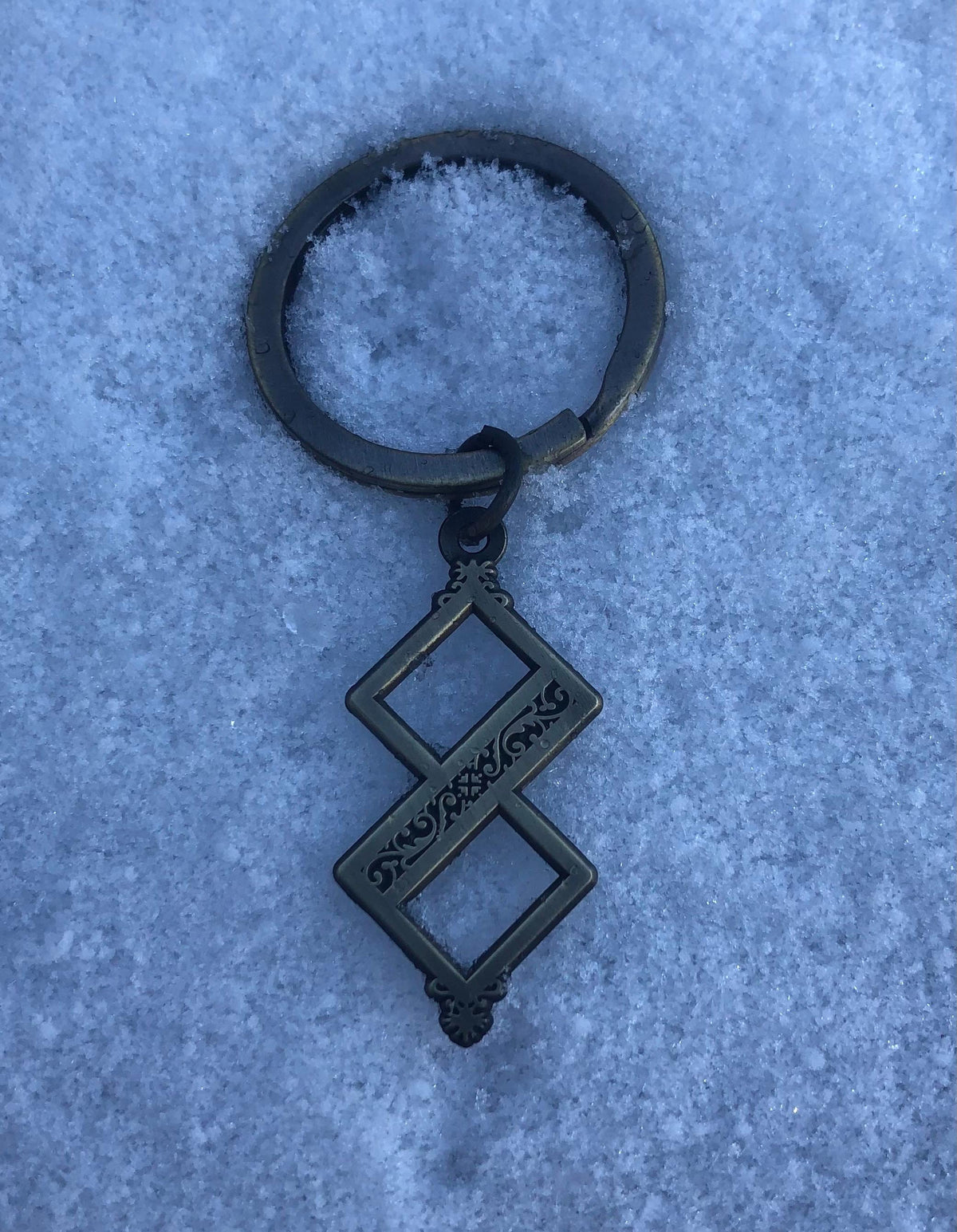 Twisted One Symbol - Blasphemous Inspired Double-sided Keychain