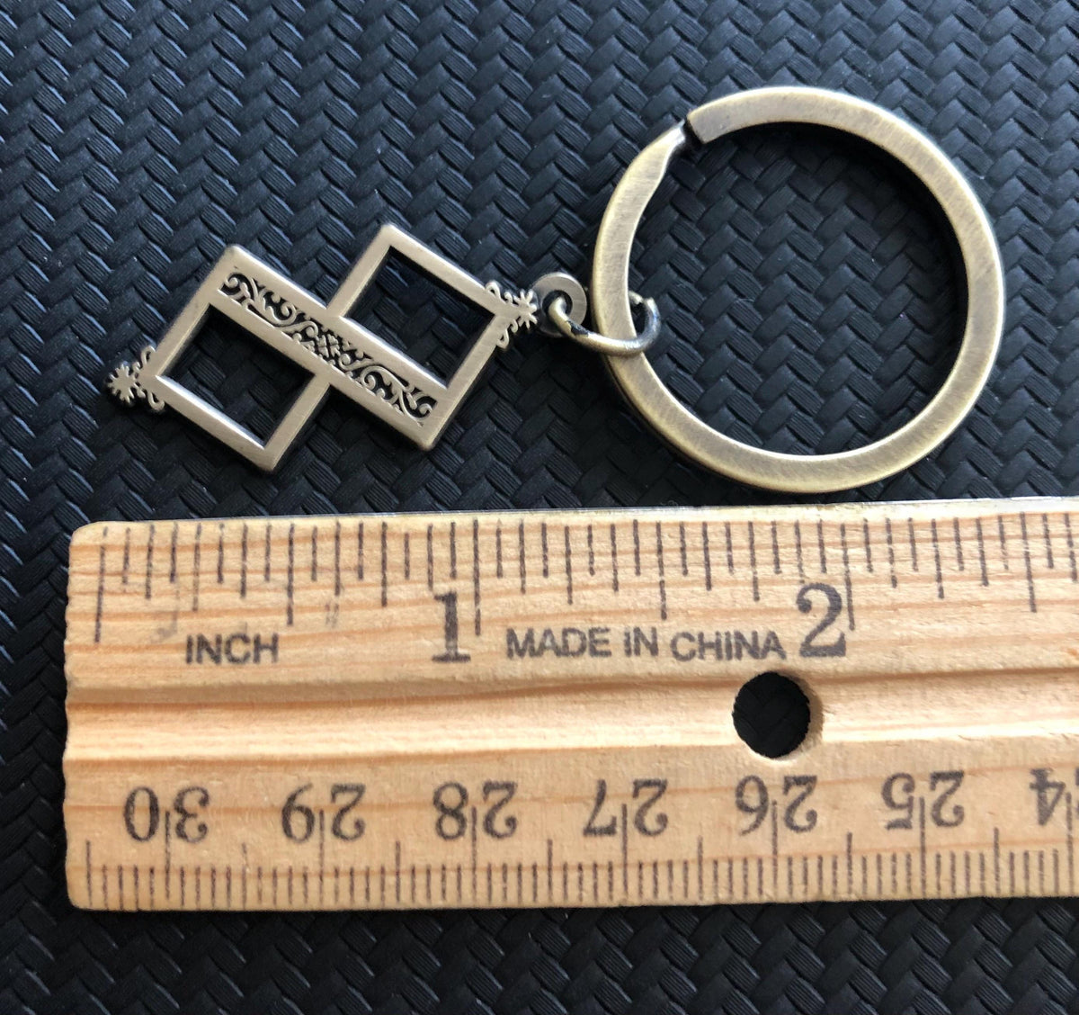 Twisted One Symbol - Blasphemous Inspired Double-sided Keychain